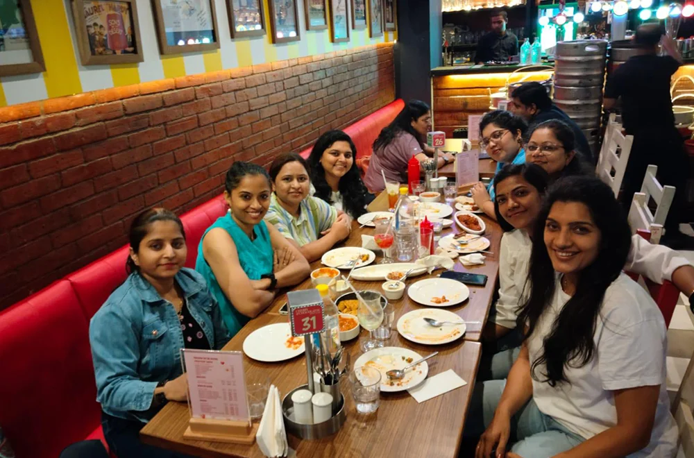 Bluemeteor colleagues sharing a meal together around a table